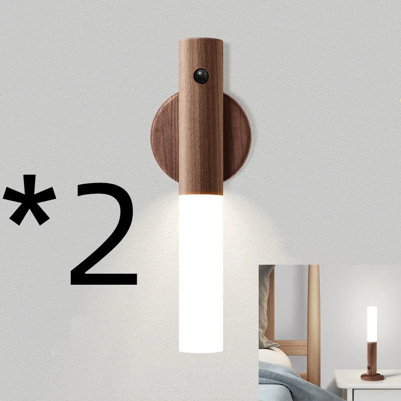 Smart sensor LED desk lamp in solid wood and acrylic on a desk, showing compact size and modern design.