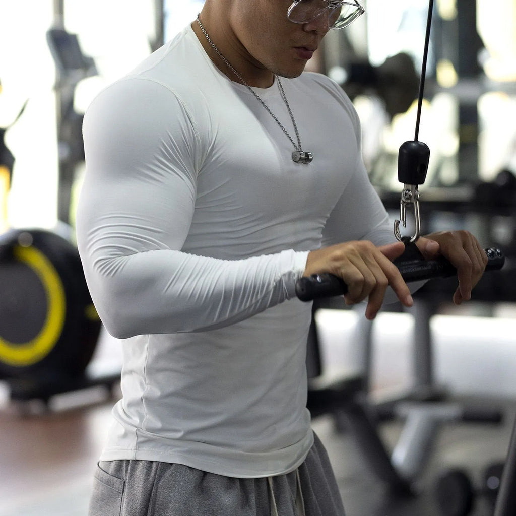 Men's slim-fit fitness tights with long sleeves in black colour for running and gym workouts