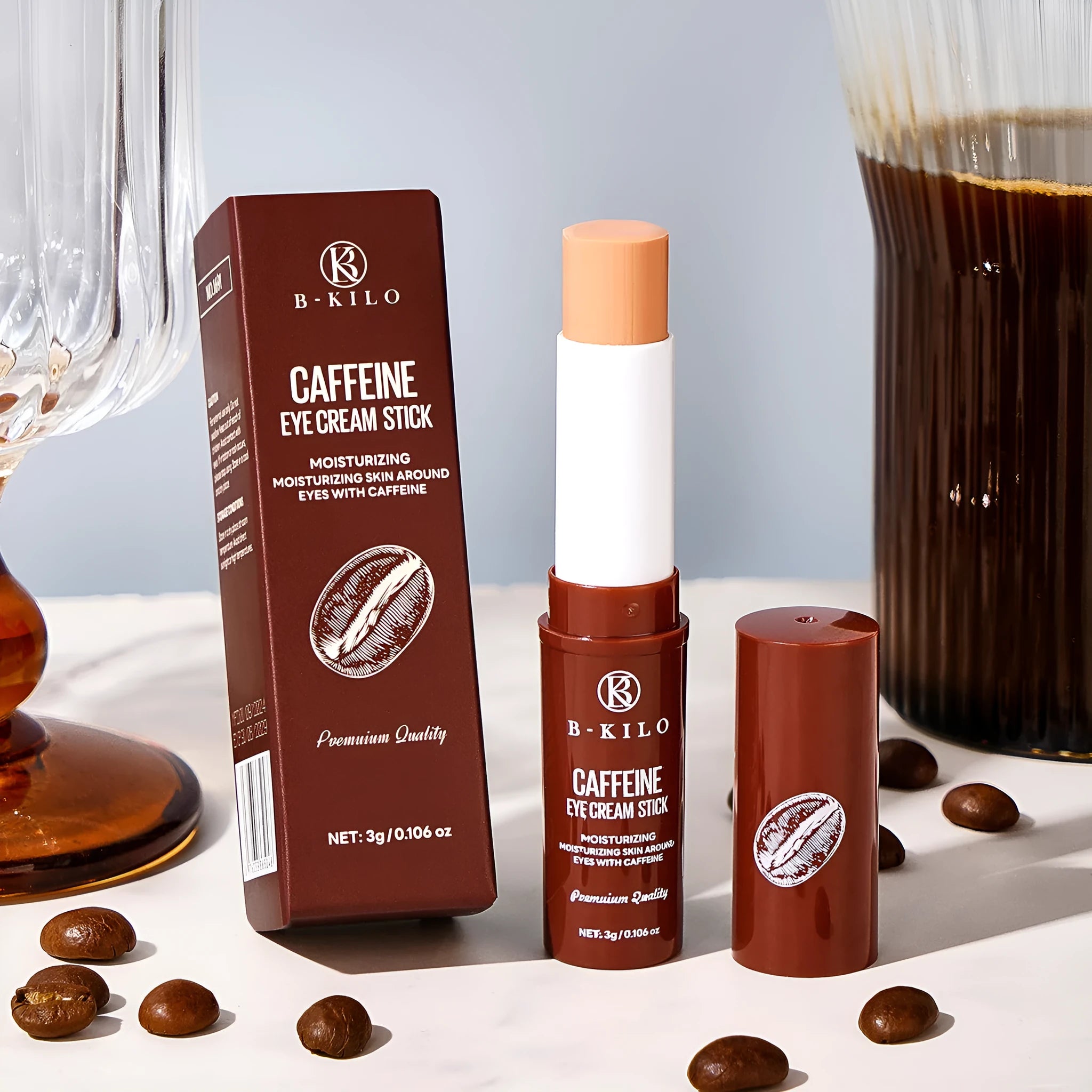 Caffeine eye cream stick in white packaging with roll-on applicator tip, 3g net content.