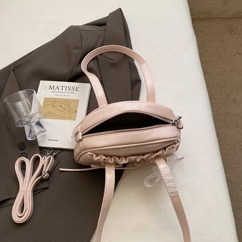 Ladies casual shoulder bag with bandage bow detail and internal mobile phone compartment
