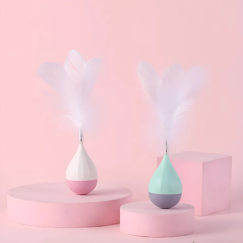 Green and pink feather tumbler cat toy with ABS plastic ball and goose feather attachment