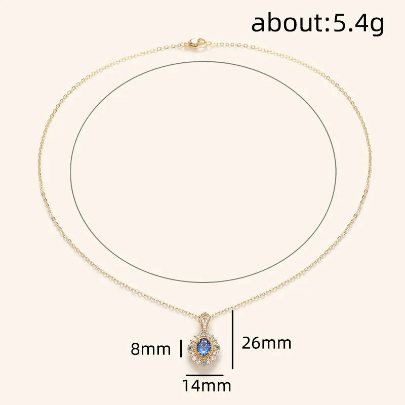 Yellow gold mixed gem pendant necklace with inlaid zircon stones on a box chain.