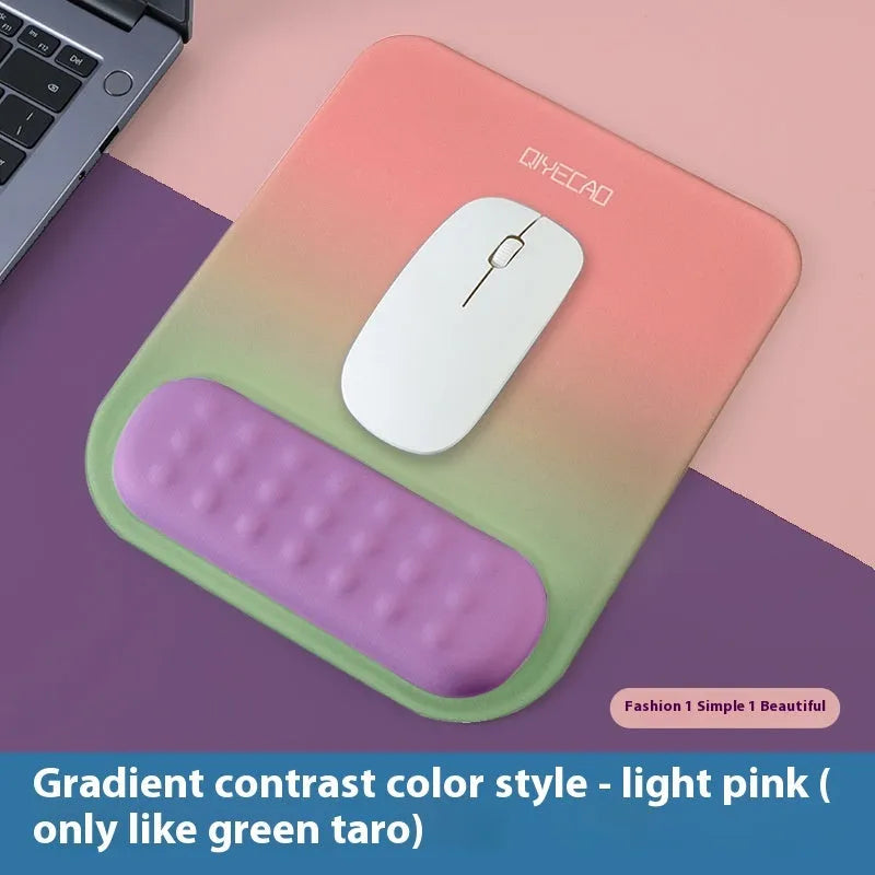 Ergonomic cloth-silicone mouse pad with raised wrist support on a desk