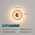 Round aluminium LED wall lamp in outer white and inner gold finish mounted on a wall.