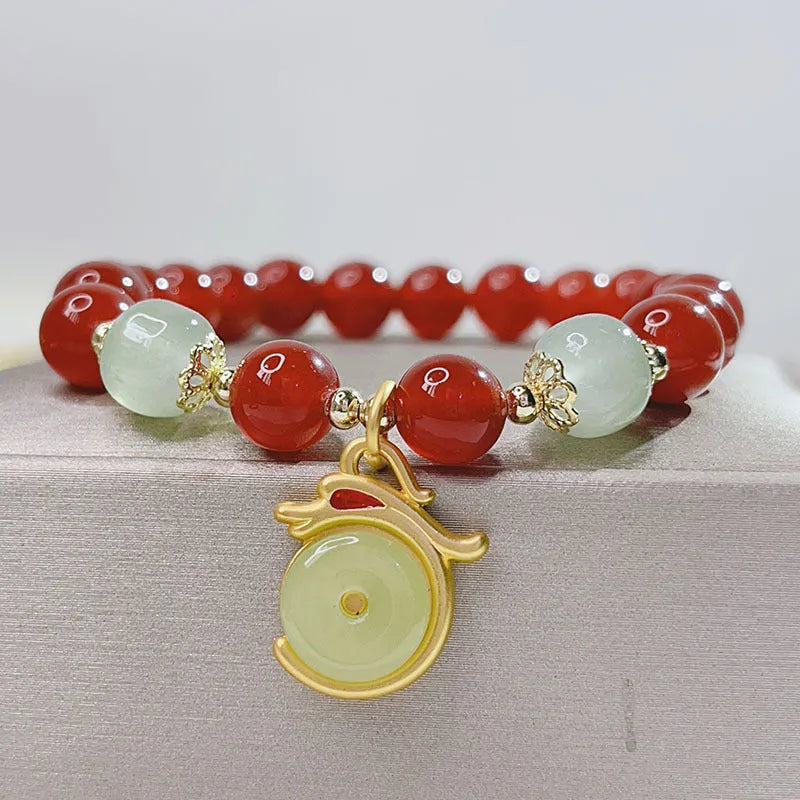 Handmade red agate bracelet with dragon motif for women, Chinese style.