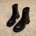 Women's flat heel ankle boots with back zip fastening in black and brown colour options
