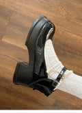 Women's black Mary Jane shoes with chunky heels and round toe design on beige background